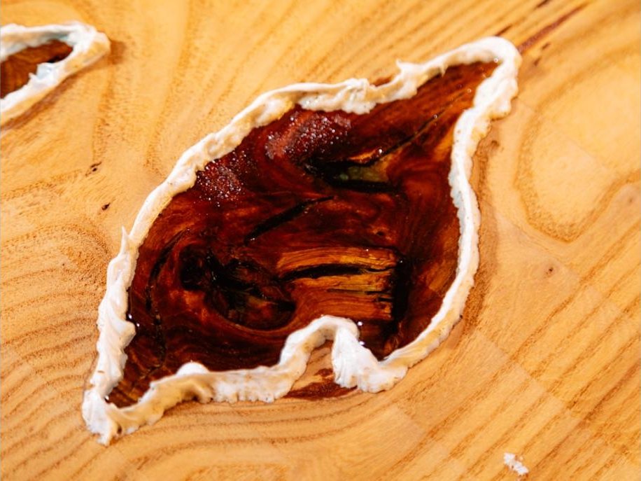 Figured ash slab with stabilized knot