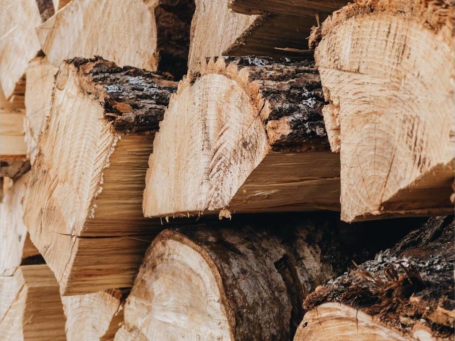 Split firewood stacked at the yard